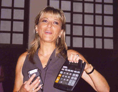 Math for Journalists - Woman holding a calculator
